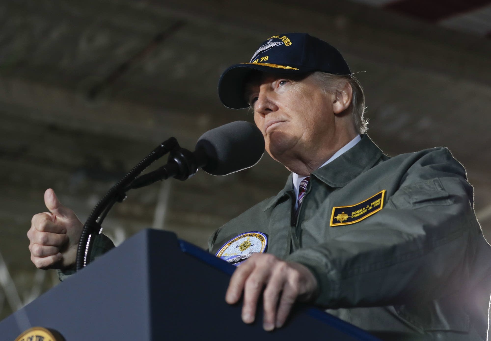 Trump, aboard Navy carrier, vows to boost defense spending